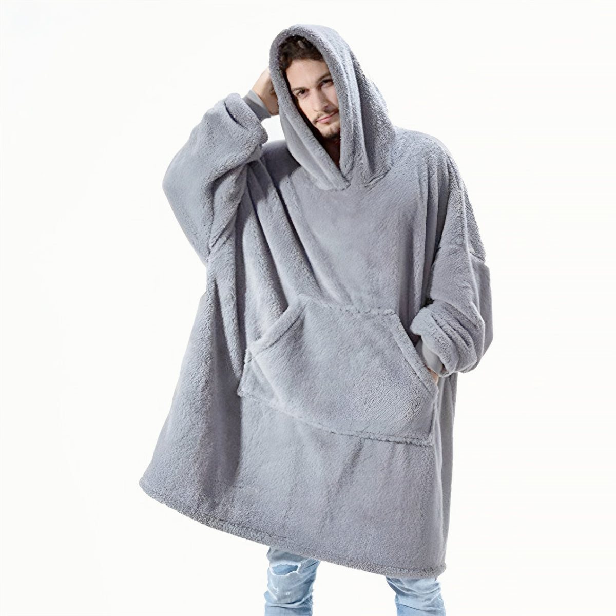 Grey oversized blanket hoodie worn by man, front view