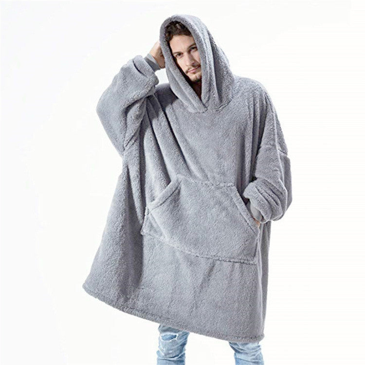 Grey oversized blanket hoodie worn by man, front view